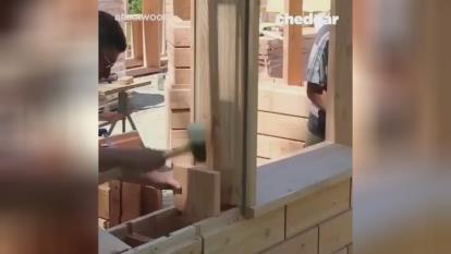 پوستر ساخت خانه ای چوبی با بلوک های چوبی Building a wooden house...